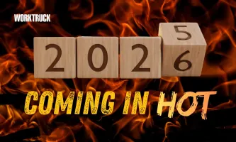 Wooden blocks showing “2026” in front of flames with the words “Coming in Hot,” symbolizing a high-pressure year of change for fleet planning and operations.