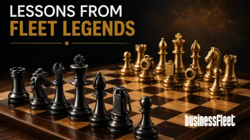 A wooden chessboard is set with custom black and gold chess pieces featuring industrial and fleet-inspired details such as gears, tools, and maintenance symbols. The pieces face off under warm lighting against a dark textured background. The headline "Lessons From Fleet Legends" appears above the board, emphasizing strategy, planning, and leadership.