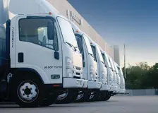 A line-up of white medium-duty trucks