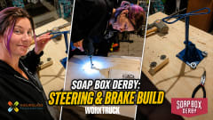 Three-panel image of a Soap Box Derby car build featuring platform assembly, steering installation, and brake system construction in a garage workshop. Text reads "Soap Box Derby: Steering & Brake Build."