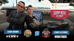 Chris Brown of Automotive Fleet and Lauren Fletcher of Work Truck pose beside a Soap Box Derby car in a Team Brown vs. Team Fletcher race graphic benefiting The Hourglass Foundation.