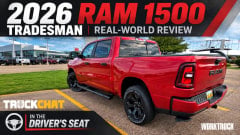 YouTube thumbnail for a Ram pickup review showing a red 2026 Ram 1500 Tradesman parked at an angle in a lot under a partly cloudy sky, with large text reading “2026 RAM 1500,” “TRADESMAN,” “REAL-WORLD REVIEW,” and “In the Driver’s Seat.”