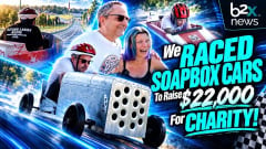 Video thumbnail showing Lauren Fletcher and Chris Brown with soapbox race cars at Derby Downs. Text reads “We raced soapbox cars to raise $22,000 for charity.”