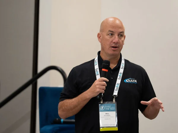 Man with microphone making presentation. 