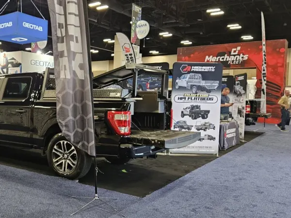 A black pickup truck with Highway Products upfit.