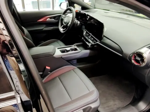 View in through open door on passenger side of small SUV.