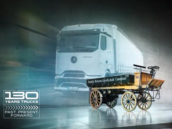 Composite image showing 1896 Daimler truck in front of a modern Mercedes-Benz electric truck with “130 Years Trucks” branding.