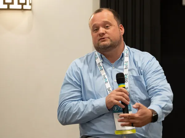 Man with microphone making presentation. 