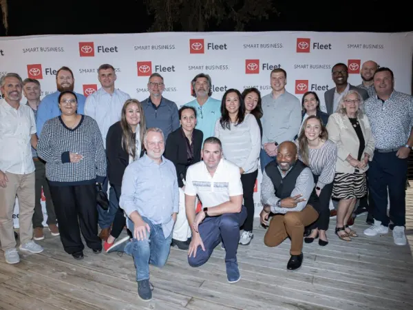 Large group poses for photo. 