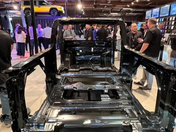 A black structural platform that forms the skeleton of the Slate vehicle.