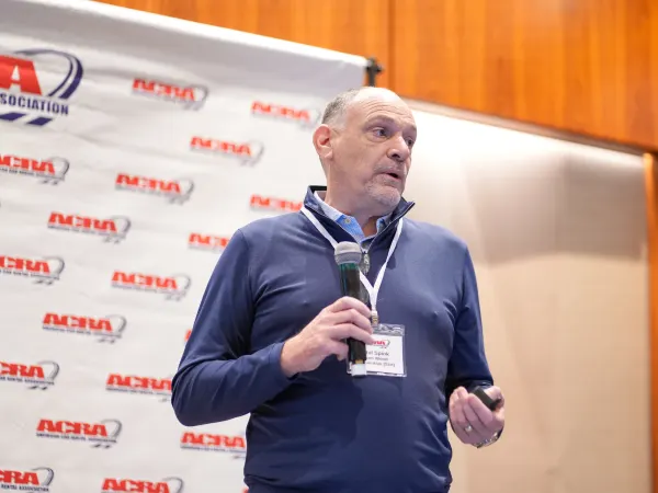 Man addresses seminar attendees