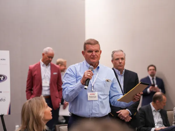 Man addresses seminar attendees