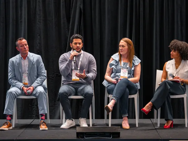 Fleet Forward attendees sit on stage to speak about new fleet voices