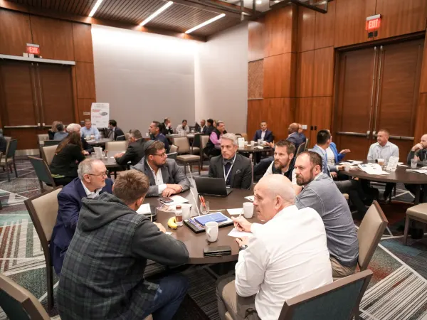 colleagues discuss solutions during roundtable session