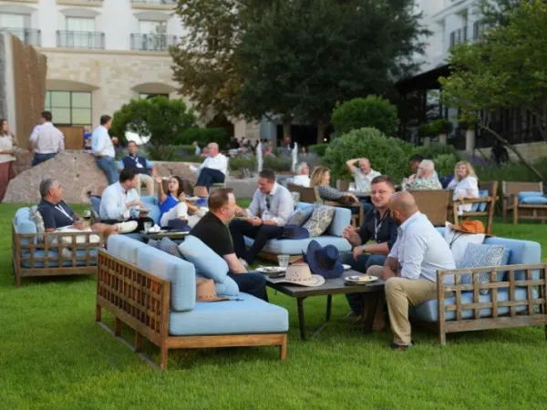 Networking on couches on the lawn.