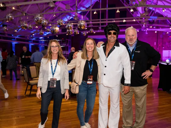 Attendees pose at closing dance party.