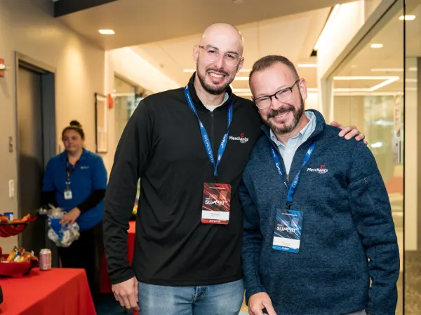 Two attendees pose for photo.