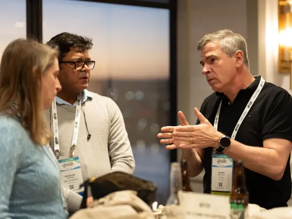 Attendees network at reception. 