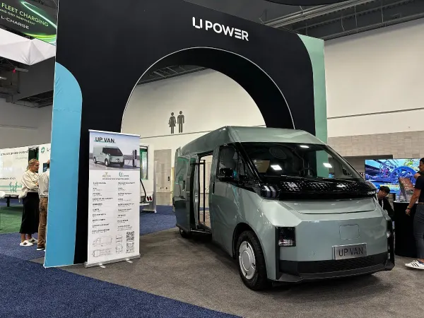 Small electric cargo van in a show floor display. 