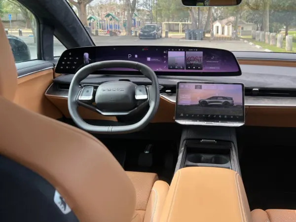 Full frontal view of the dashboard control area from the rear seat.