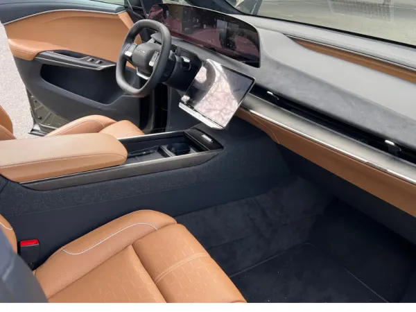 Inside view of front dash area from the open right front door.