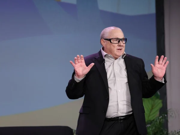 Man delivers keynote from stage.