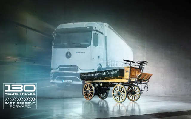 Composite image showing 1896 Daimler truck in front of a modern Mercedes-Benz electric truck with “130 Years Trucks” branding.