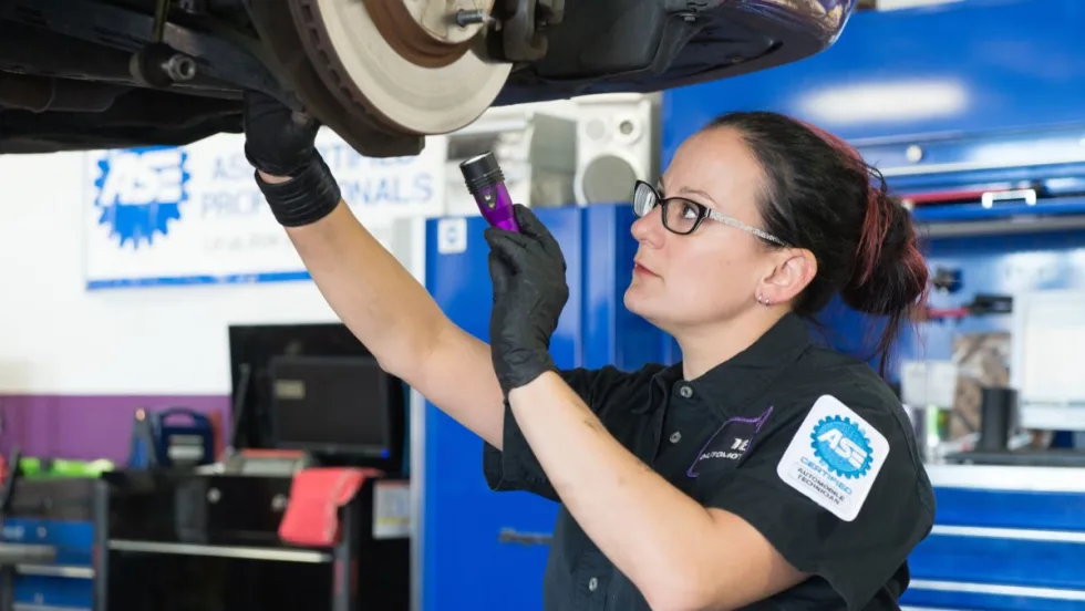 Technician working on a vehicle