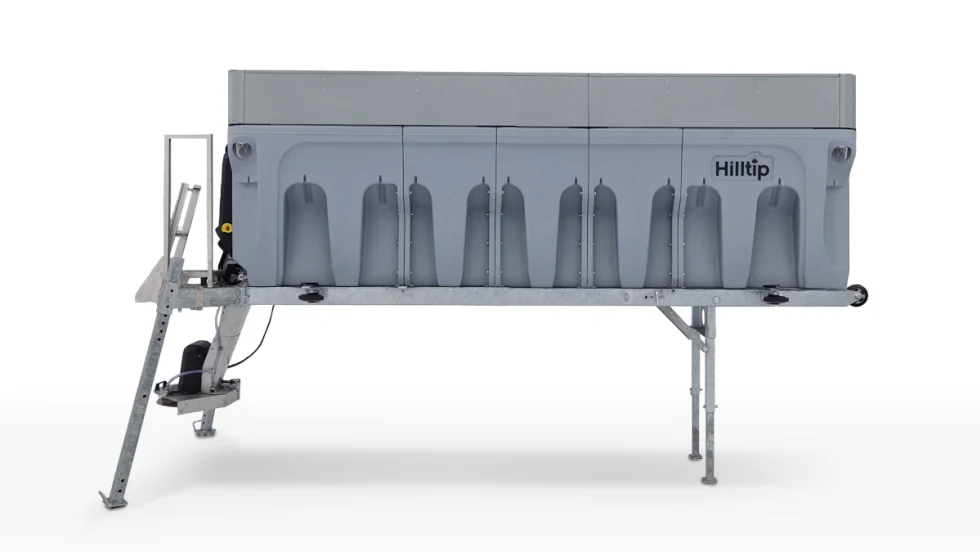 Photo of a spreader, large box-like bin that fits on the back of a truck.
