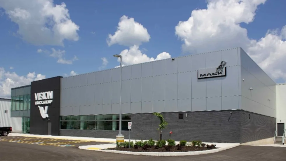 Commercial building with logo for Mack Trucks and Vision Truck Center.