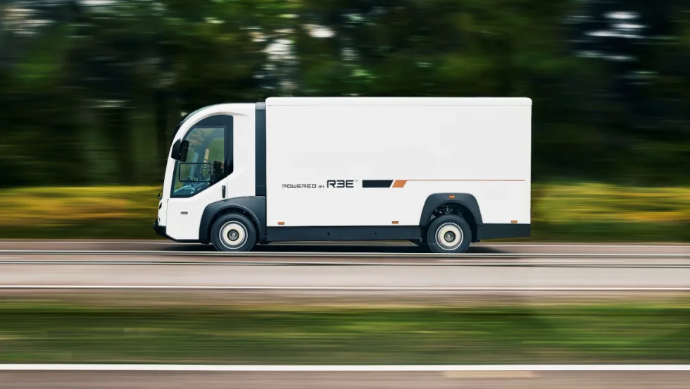 Side view of a white battery-electric truck.