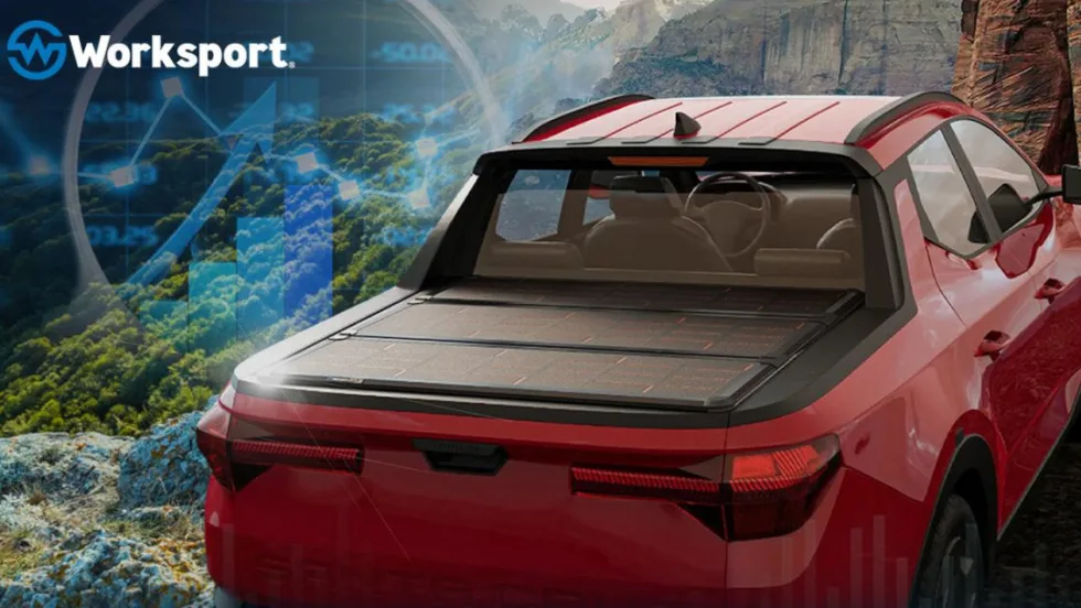 Red pickup truck with a tonneau cover with solar cells.