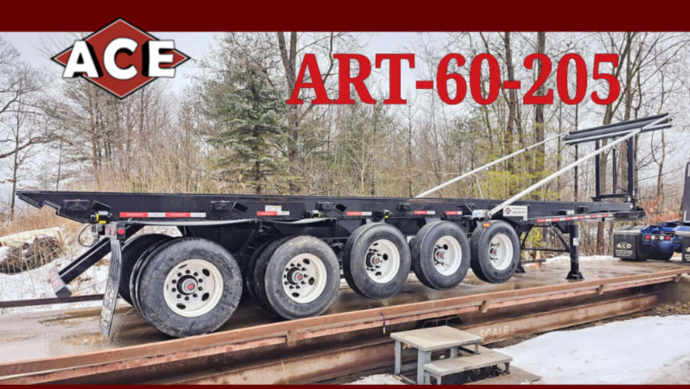 Photo of trailer with two regular axles and five lifted axles parked on a scale.