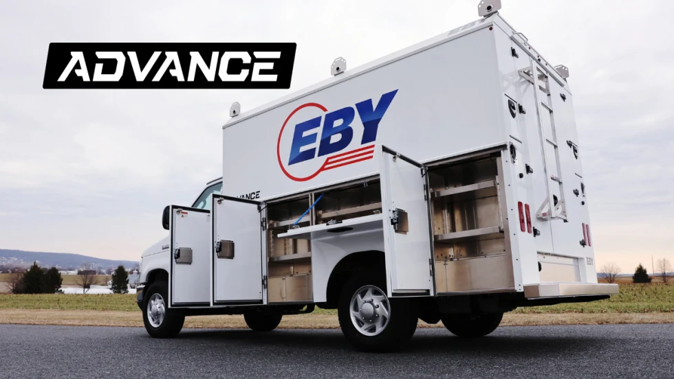 quarter-side rear view of a white service truck with cabinet doors open.