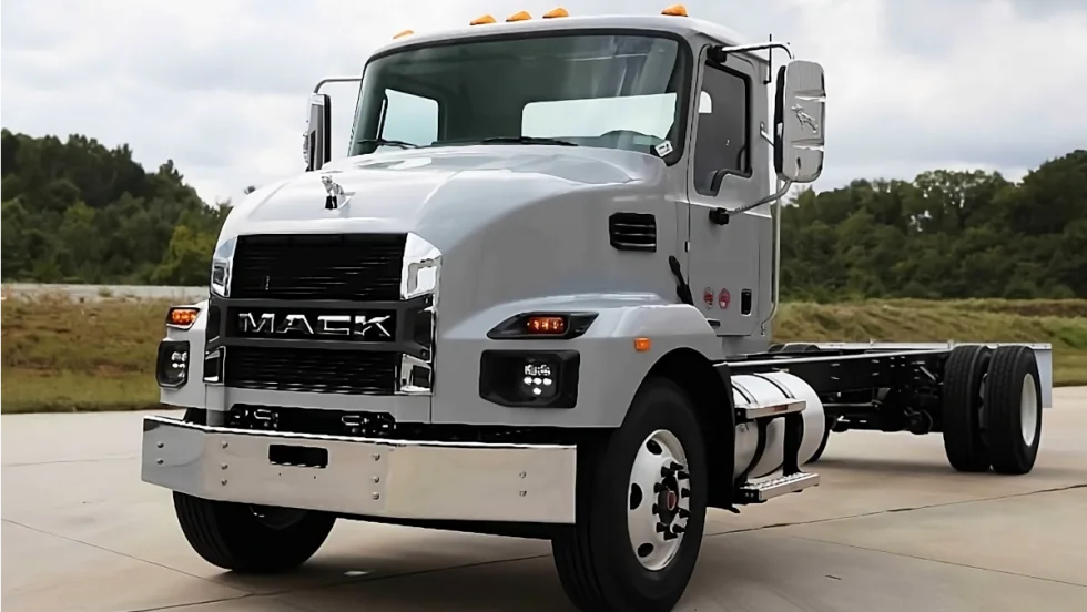 Gray chassis cab Mack truck parked.