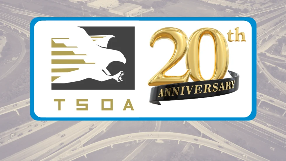 Tinted background image of a highway interchange with white box in front containing logo for TSOA and a graphic for 2oth anniversary.