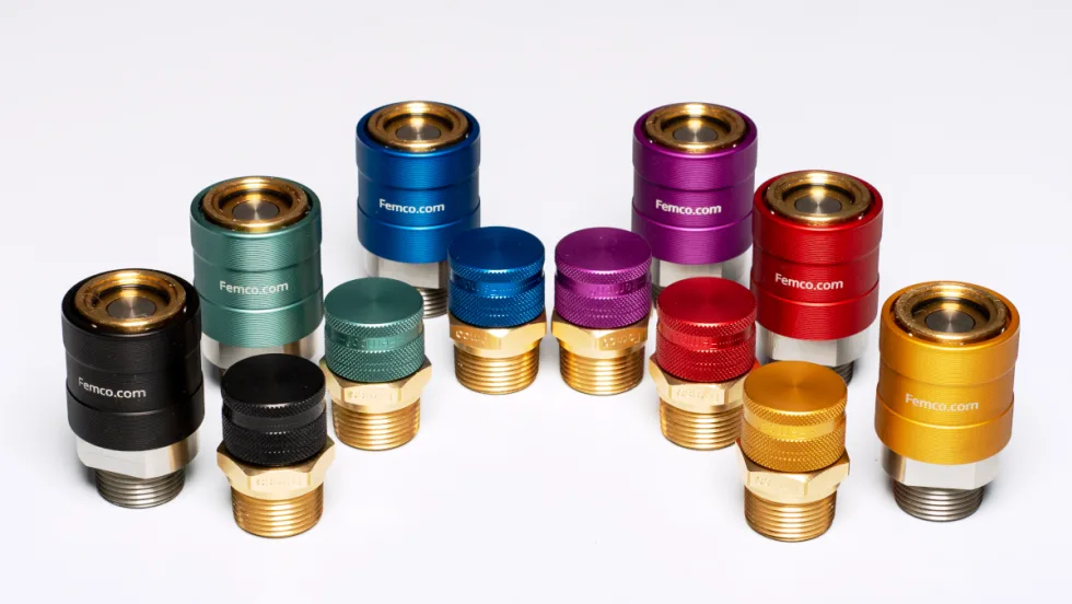 Various colors of fluid drain plugs against a white background.