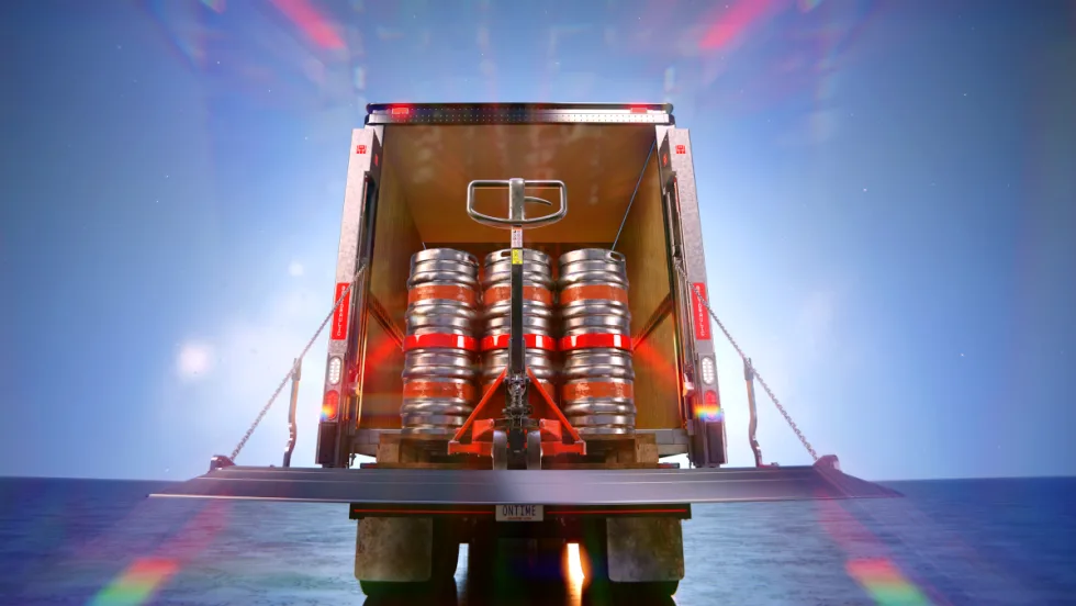 Rear of truck with liftgate and cargo inside.