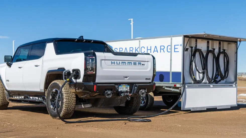 SparkCharge mobile EV charging unit powering up a Hummer EV in a remote location.