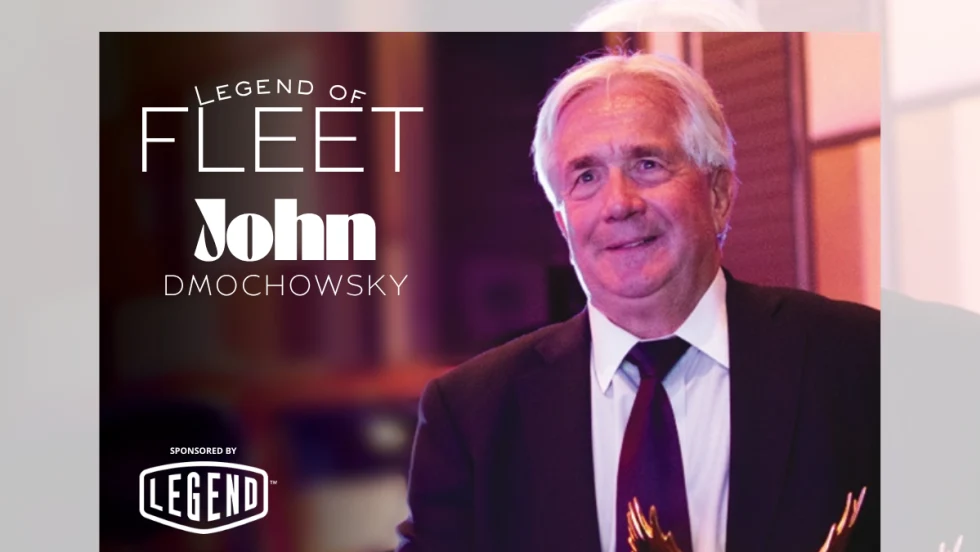 Fleet leader John Dmochowsky poses with industry awards recognizing his decades of service, innovation, and impact in commercial and global fleet operations.