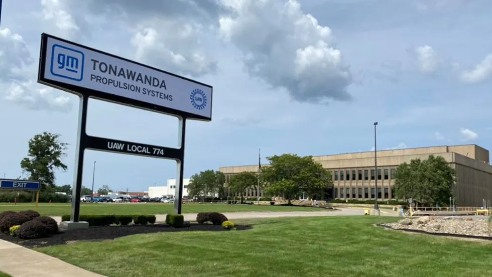 Front view of the GM Tonawanda Propulsion Systems plant in Buffalo, New York, showing the main sign with UAW Local 774 and the facility in the background on a partly cloudy day.