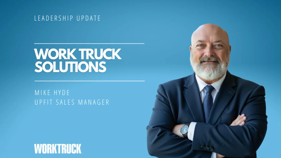 Man in business attire in front of a blue background and white text stating Leadership Update, Work Truck Solutions, and the man's name and title.