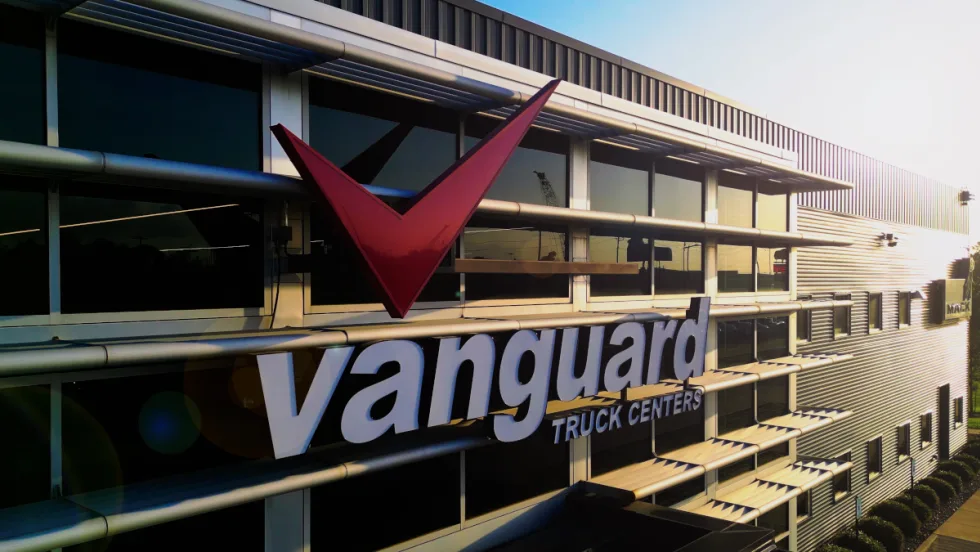 Exterior view of an industrial-looking building with signage for Vanguard.