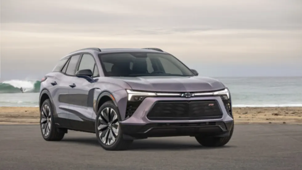 Front view of a silver Chevrolet Blazer EV parked near the ocean, named the most affordable EV to insure by Mercury Insurance.