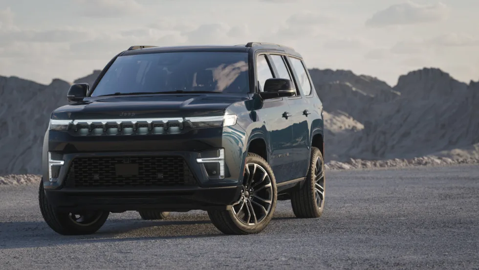 Front view of the 2026 Jeep Grand Wagoneer with illuminated grille and LED lighting.