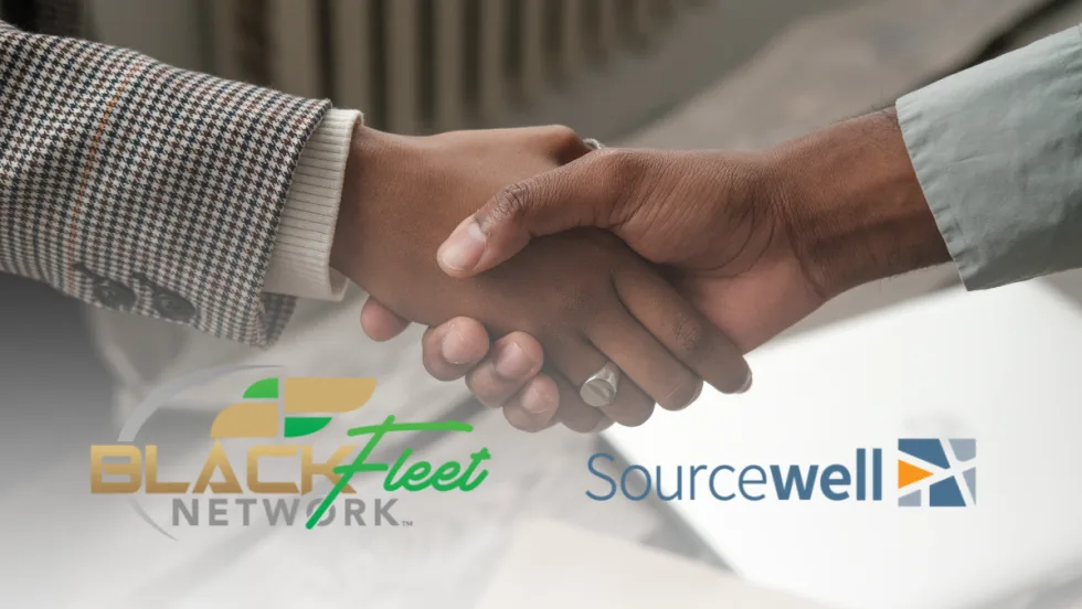 Two people shake hands representing a new partnership between Black Fleet Network and Sourcewell to strengthen fleet education and professional growth.