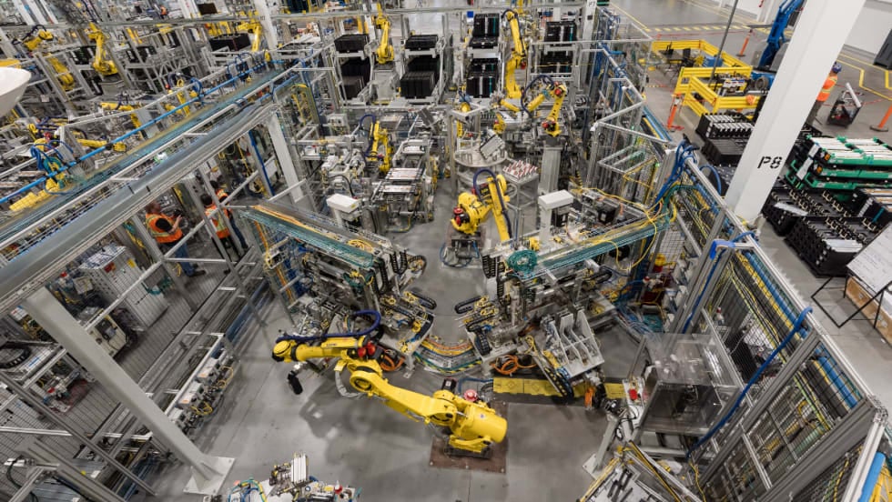 Robotic equipment operates on the production floor at GM’s CAMI Assembly plant in Ontario, where BrightDrop electric delivery vans were built before production ended.