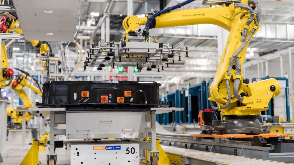 A robotic arm works on an EV battery component at a General Motors factory, reflecting the company’s ongoing adjustments to electric vehicle production capacity.