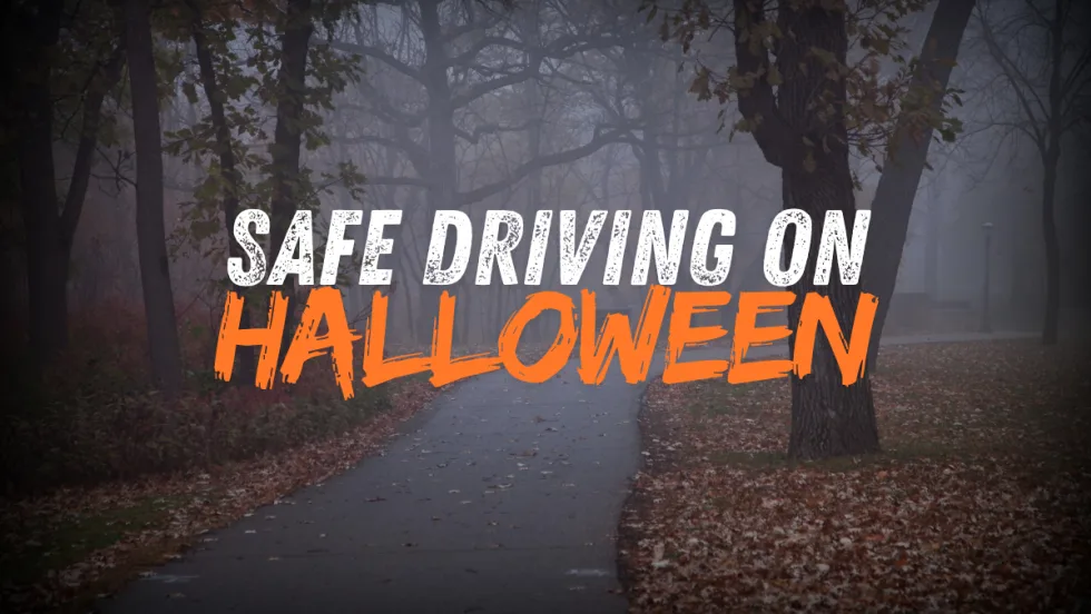 Safe Driving on Halloween over spooky fall road