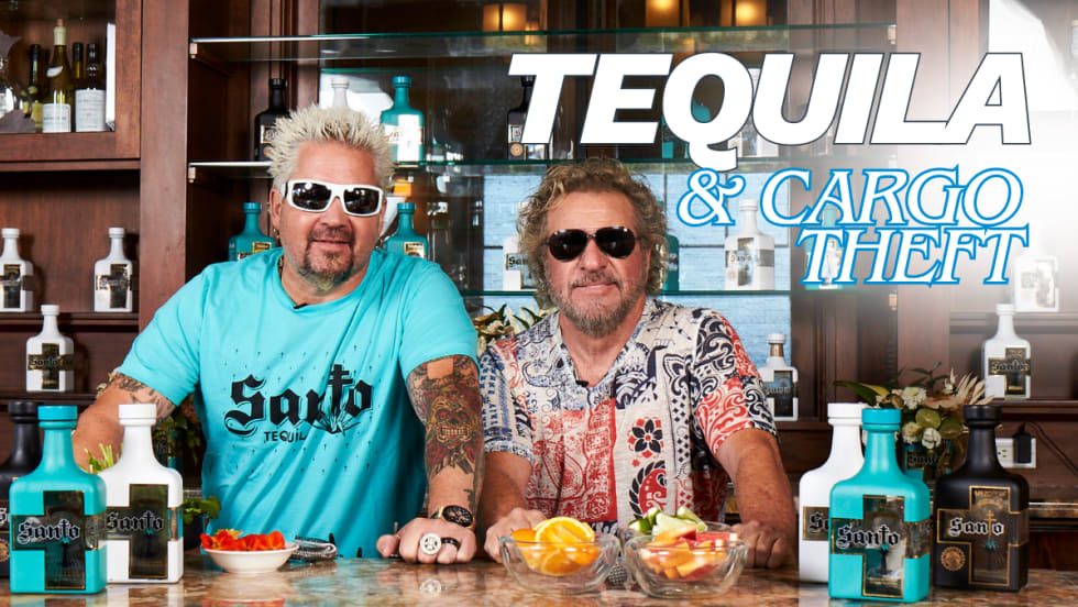 Guy Fieri and Sammy Hagar standing behind bottles of Santo Tequila, representing a digital cargo theft case involving stolen shipments worth over $1 million.
